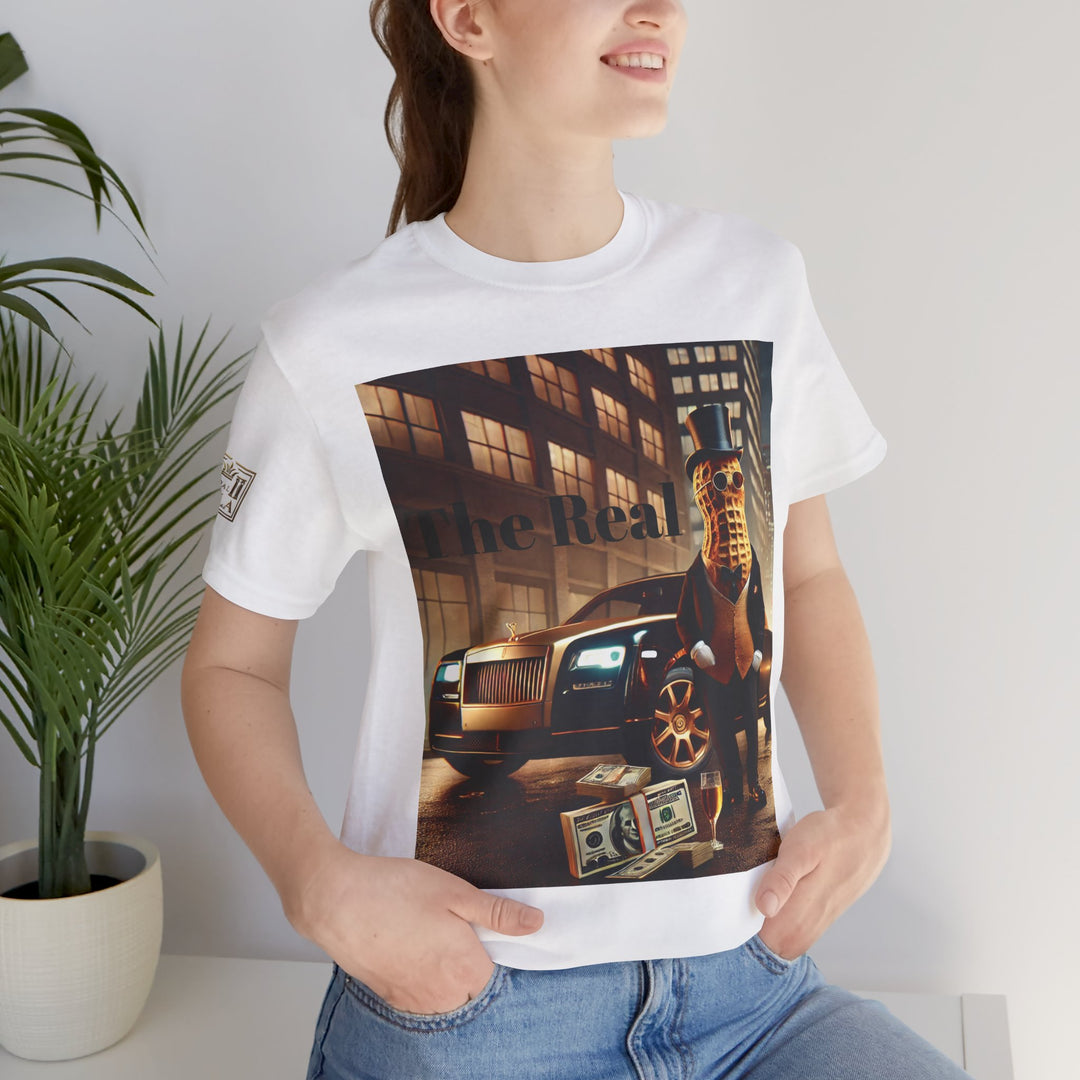 Woman wearing Luxury Tee white shirt with a vibrant graphic of a peanut in a suit, Rolls-Royce, and money, styled for youthful casual fashion.