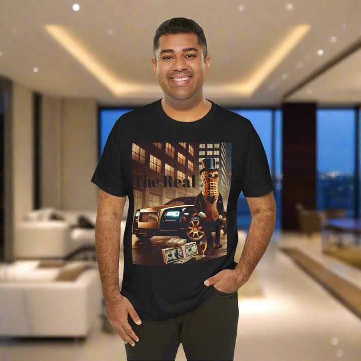 Smiling man in Luxury Tee black shirt featuring a luxury lifestyle graphic with a peanut figure, Rolls-Royce, and cash, perfect for casual wear.