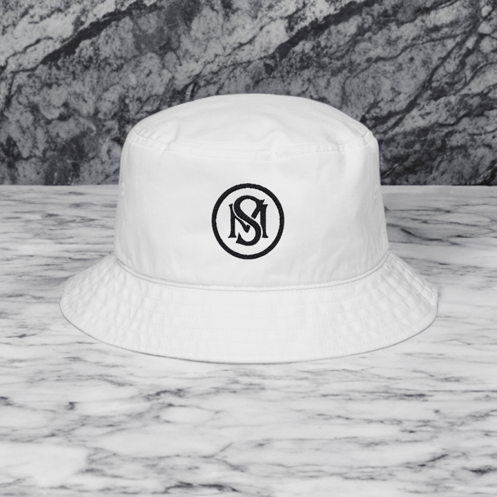 Era Emblem Hat - Selfmade EraHatsSelfmade EraWhite cotton twill Era Emblem Hat featuring a centered black embroidered emblem. A trendy bucket hat for outdoor and everyday wear.