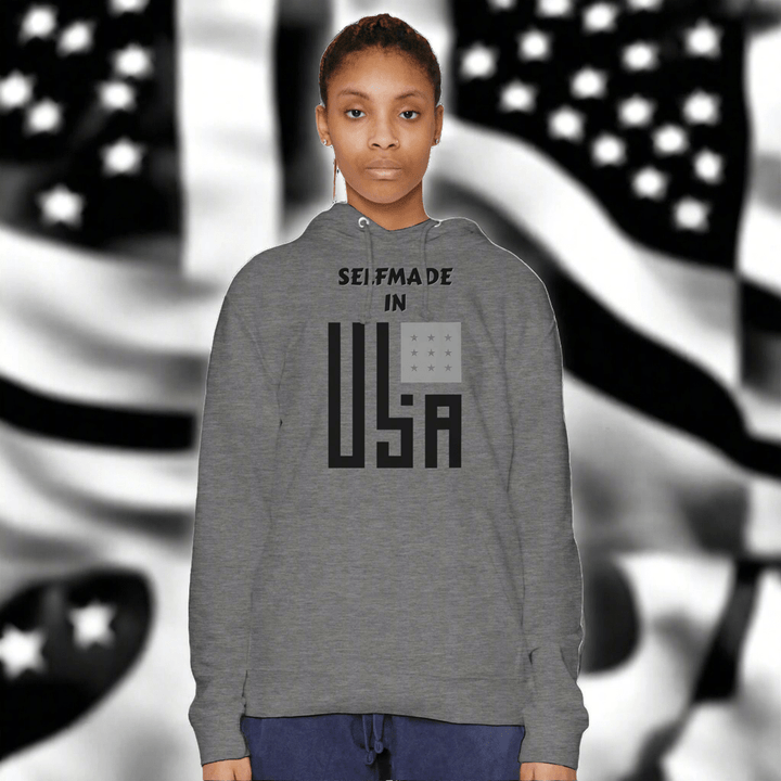 Premium Hoodie - Selfmade EraHoodieSelfmade EraFemale model in gray Premium Hoodie with bold 'Selfmade in USA' graphic, offering a unisex fit and cozy style for modern casual fashion.
